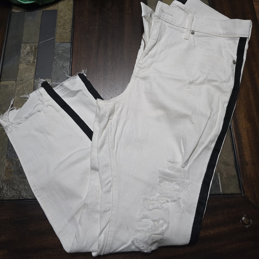 Express Brand White Jeans with Black Stripe. Distressed look on front legs